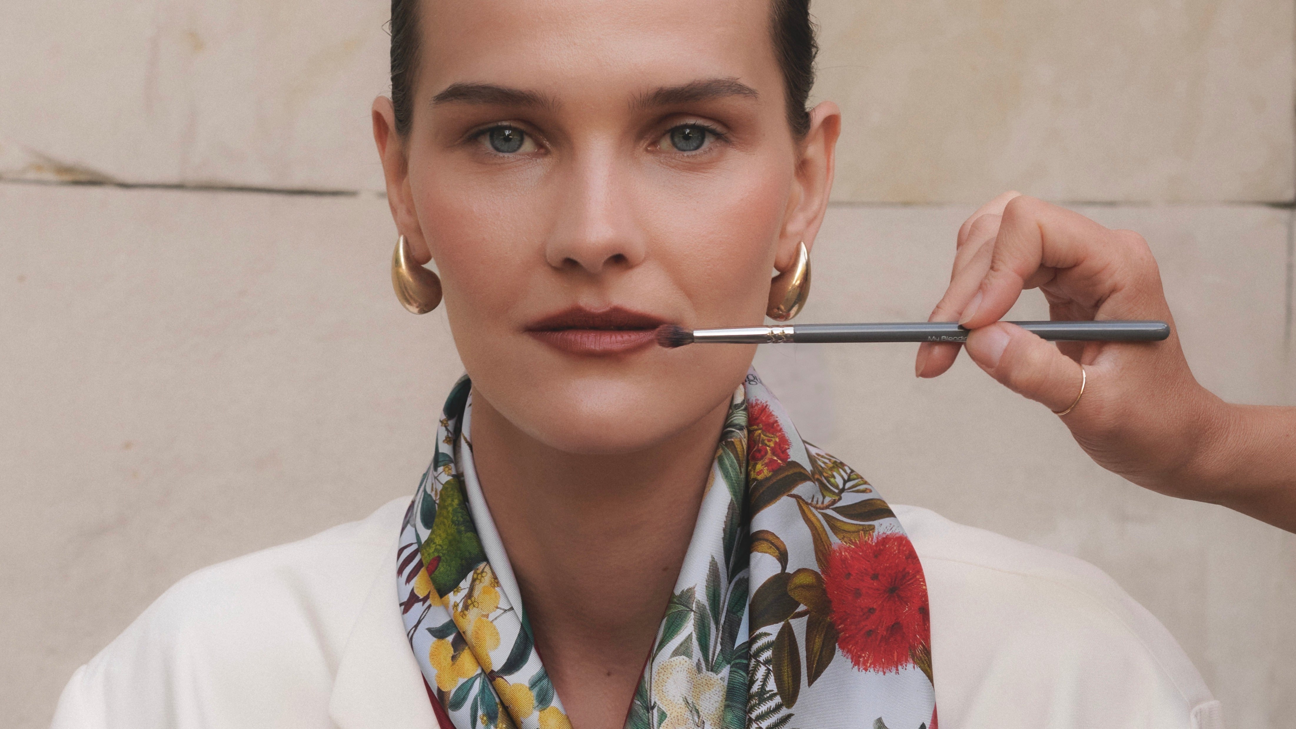 Women-wearing-a-silk-scarf-on-a-white-background
