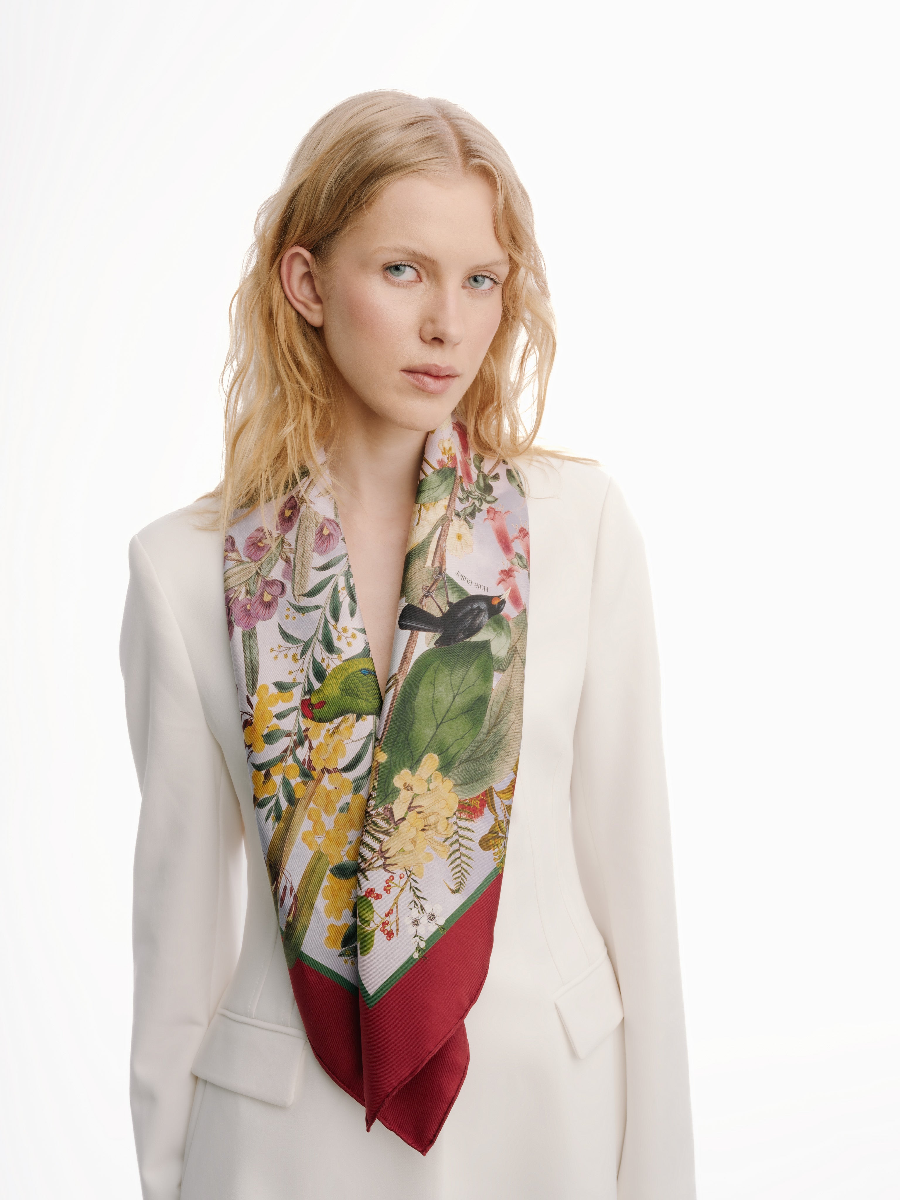 women-in-white-suit-with-luxurious-silk-scarf