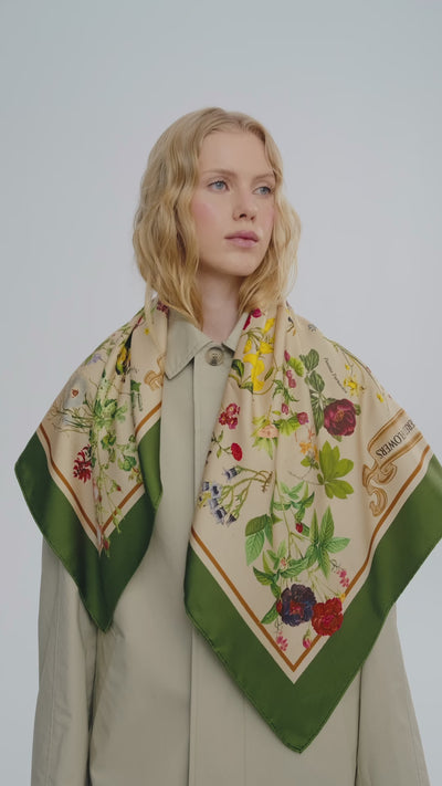 video-of-a-blond-women-wearing-luxury-silk-scarf-with-botanic-flowers