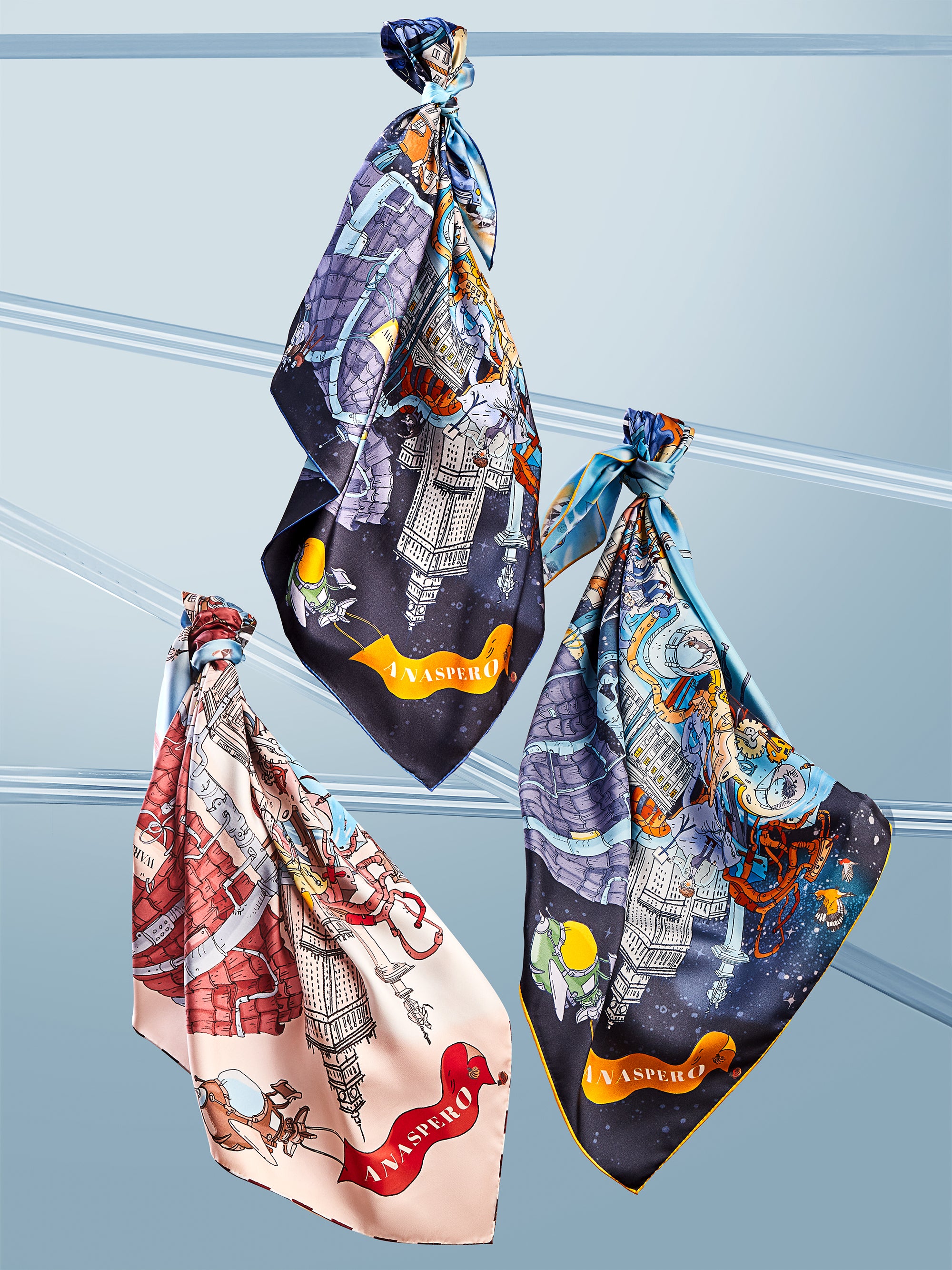 Three-colourful-silk-scarves-hanging-on-tubes
